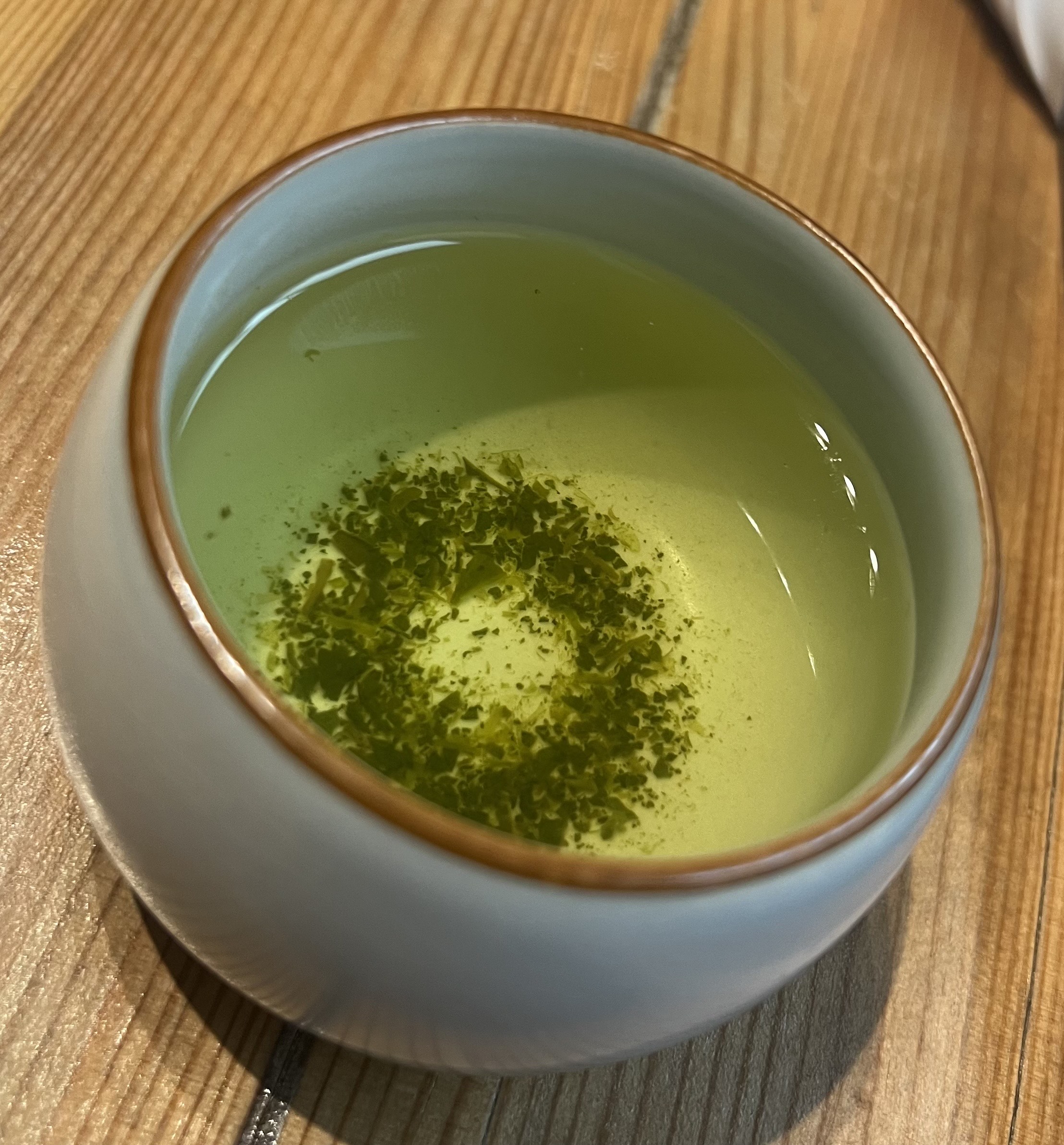 Cup of the sencha tea, with all of the debris