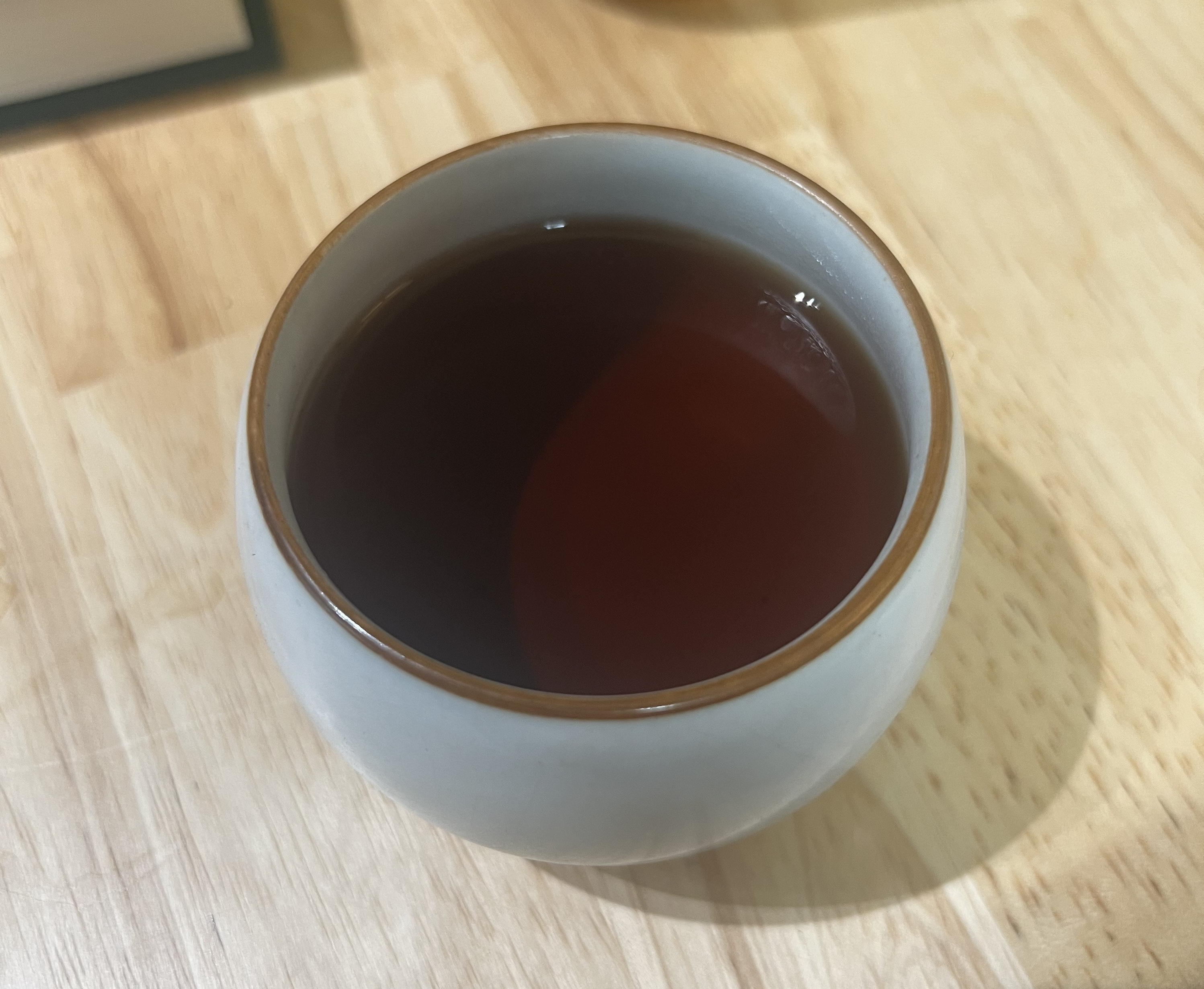 Cup of the Pu-Erh tea, a deep red color.